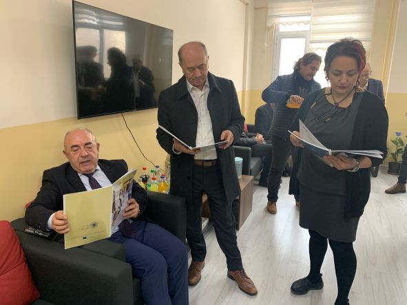 Teachers and headmasters reading the Fit to Belong outputs